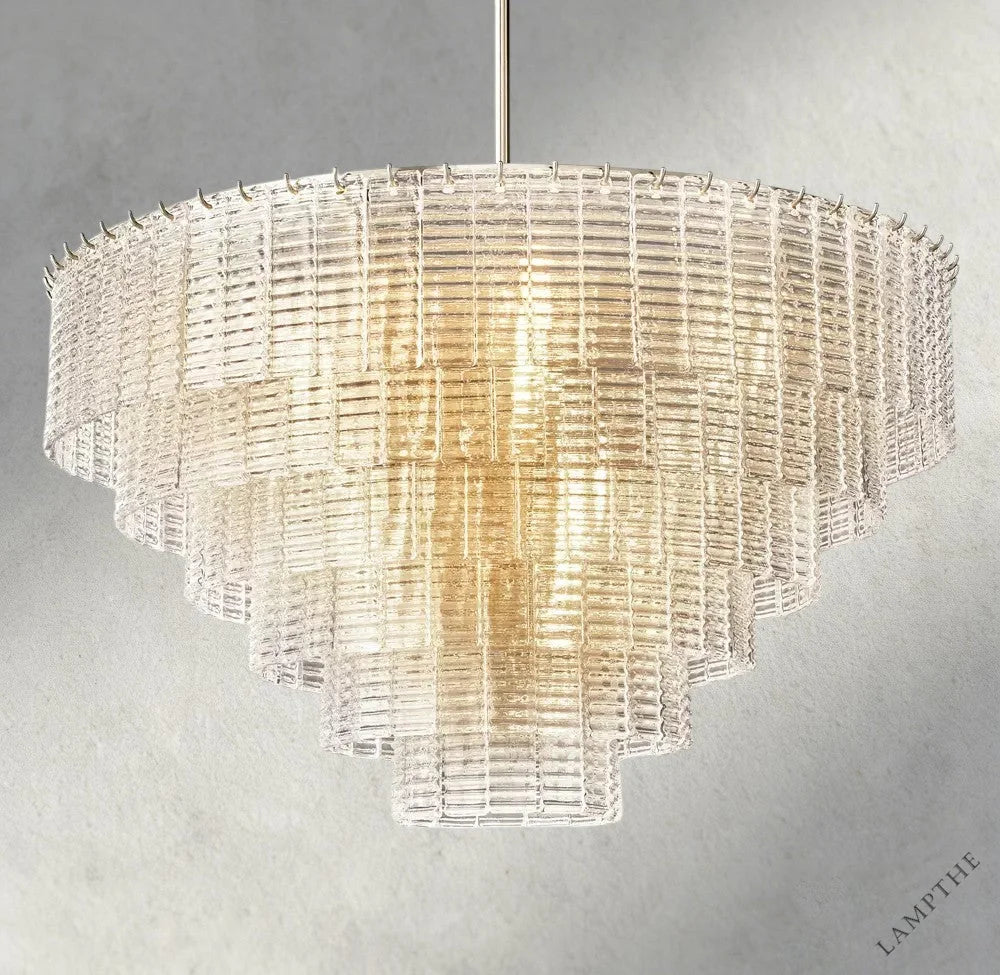 Lampthe Sirene clear glass tiered chandelier with textured cast glass cascading in concentric rings, emitting warm refracted light.