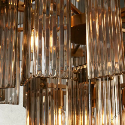 Lampthe Delsie Collection chandelier with reeded glass panels and steel frame, radiating old Hollywood glamour.