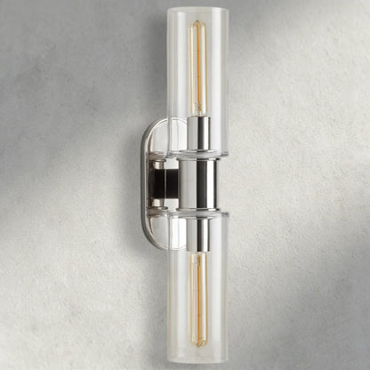 Lampthe Harlin double wall sconce with clear glass shades and polished nickel finish. Modern sophistication.