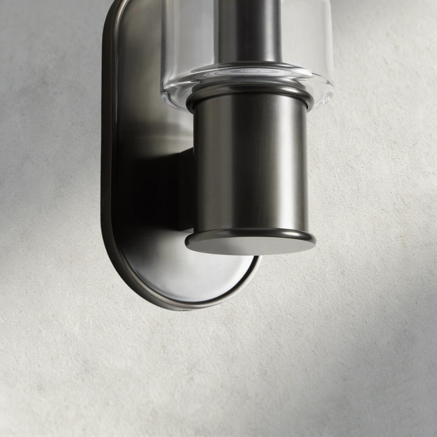Lampthe Harlin Sconce in clear glass and brushed nickel finish, featuring a modern, sophisticated design.