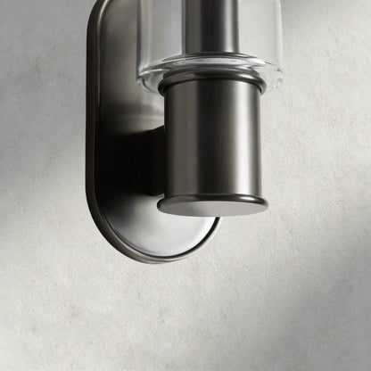 Lampthe Harlin Sconce in clear glass and brushed nickel finish, featuring a modern, sophisticated design.