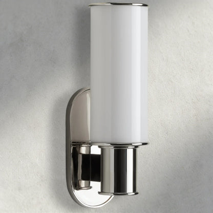 Lampthe Harlin Sconce in milk white glass with polished nickel finish, featuring a cylindrical shade and oval backplate.
